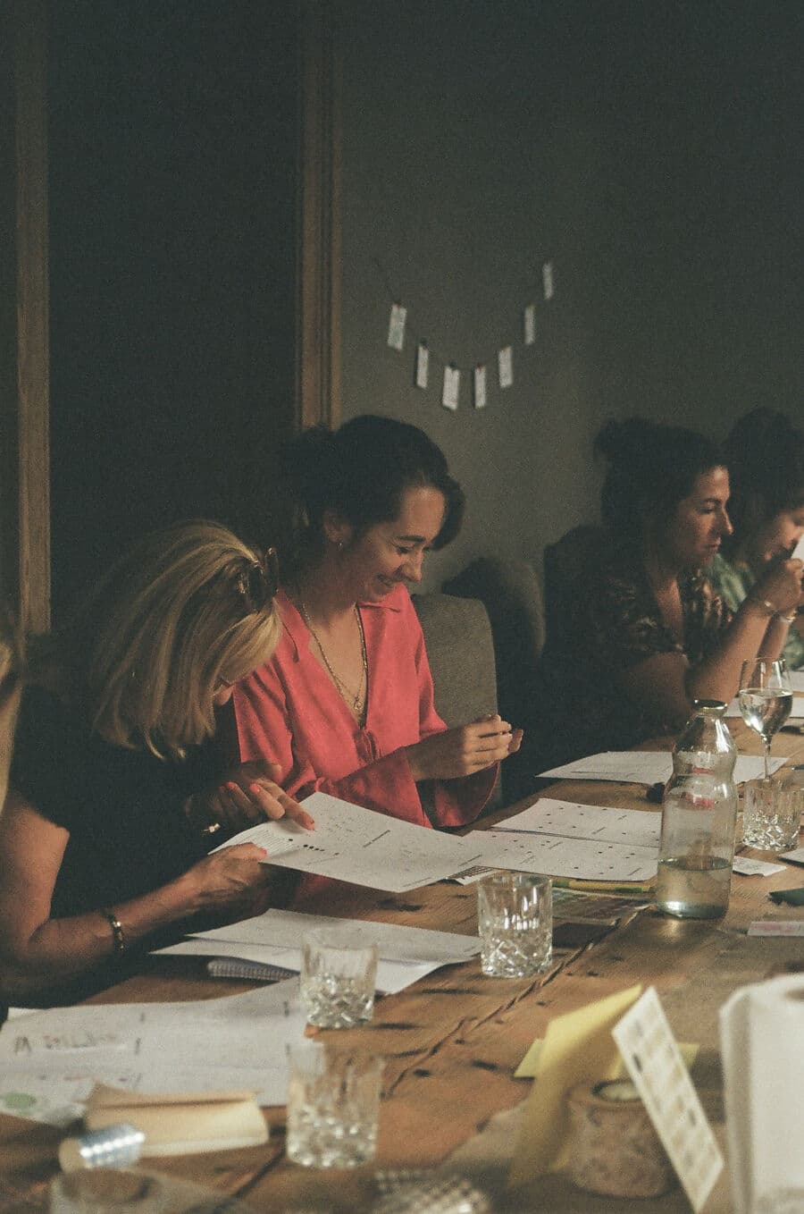 A guest laughing while reading her page, a chart on the table